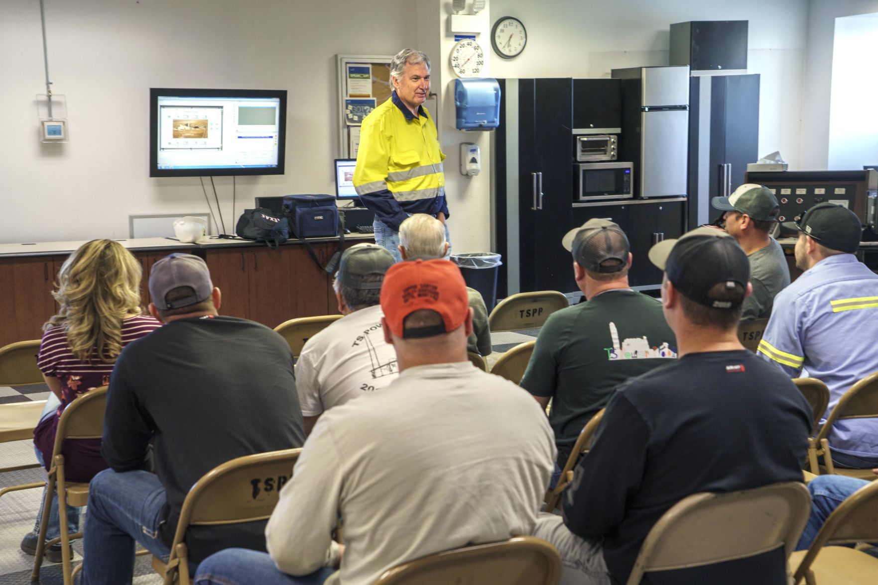 Greg Walker talks with NGM employees